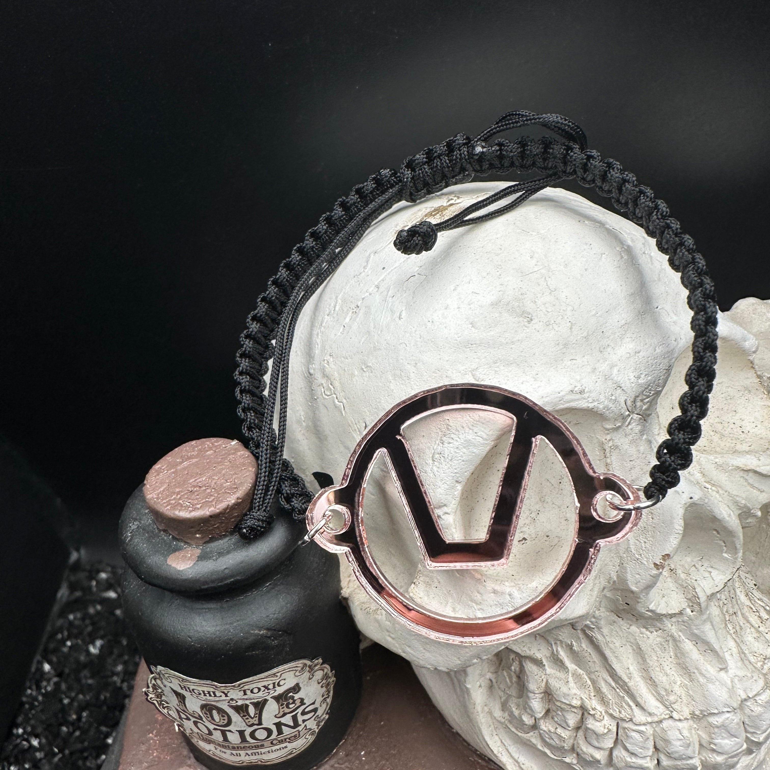 Swinger Symbol Blush Acrylic Bracelet on Adjustable Black Cord