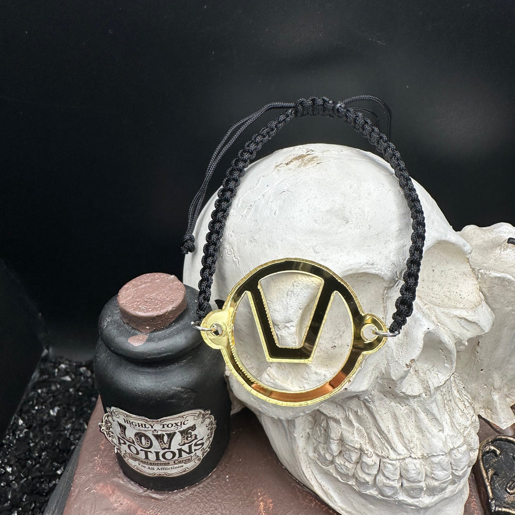 Swinger Symbol Gold Acrylic Bracelet on Adjustable Black Cord