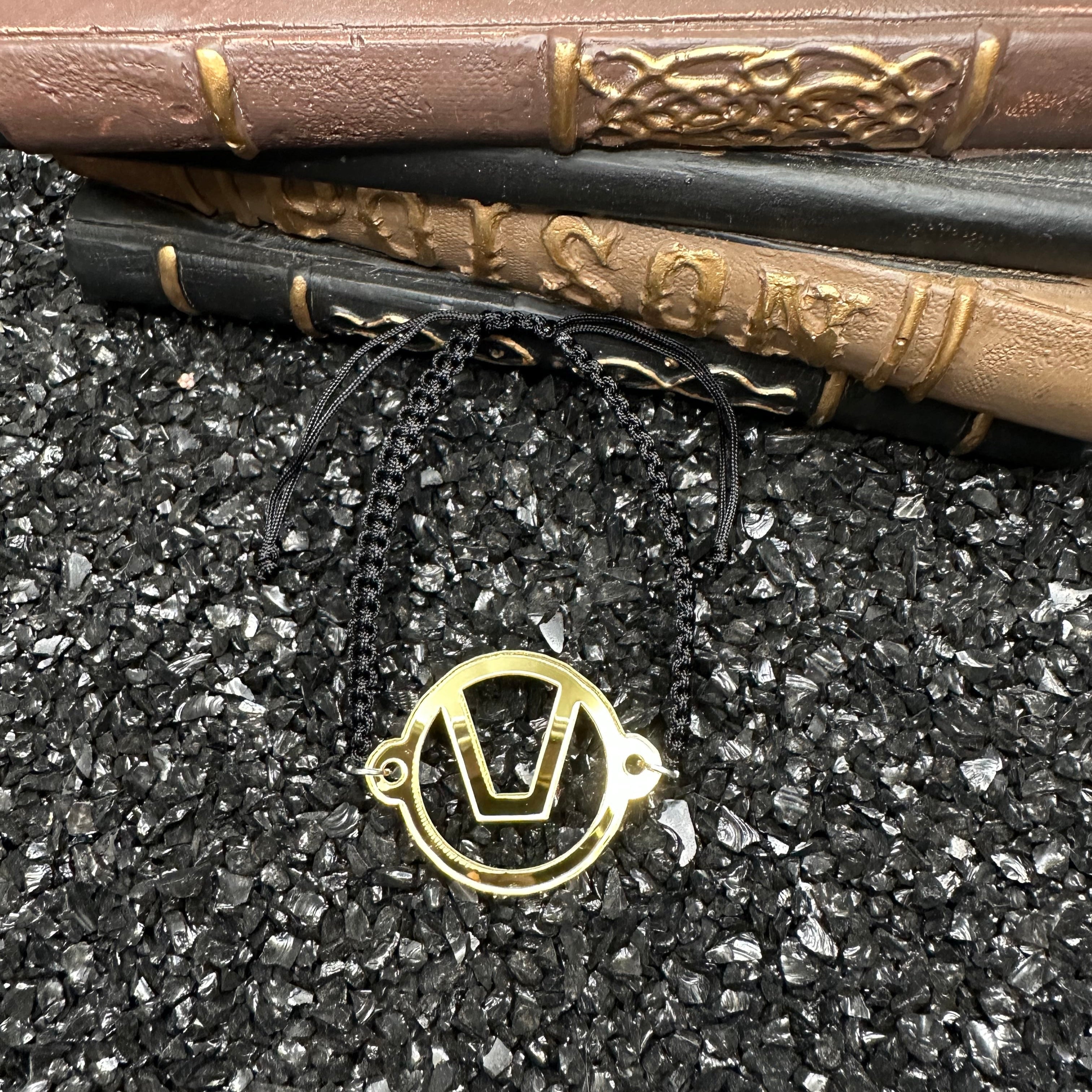Swinger Symbol Gold Acrylic Bracelet on Adjustable Black Cord